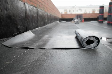 repair flat roof rubber membrane